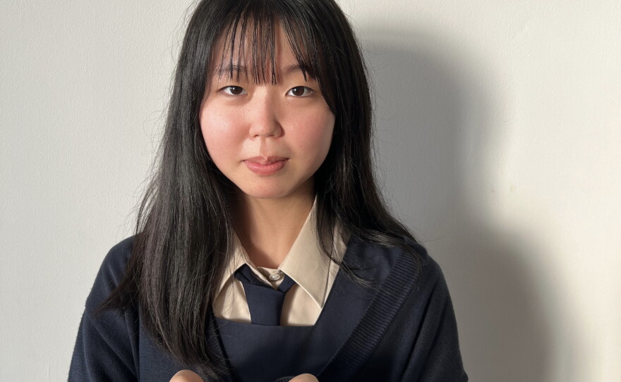 Rika Matsuda with the origami crane from her unsung hero, in 2023.