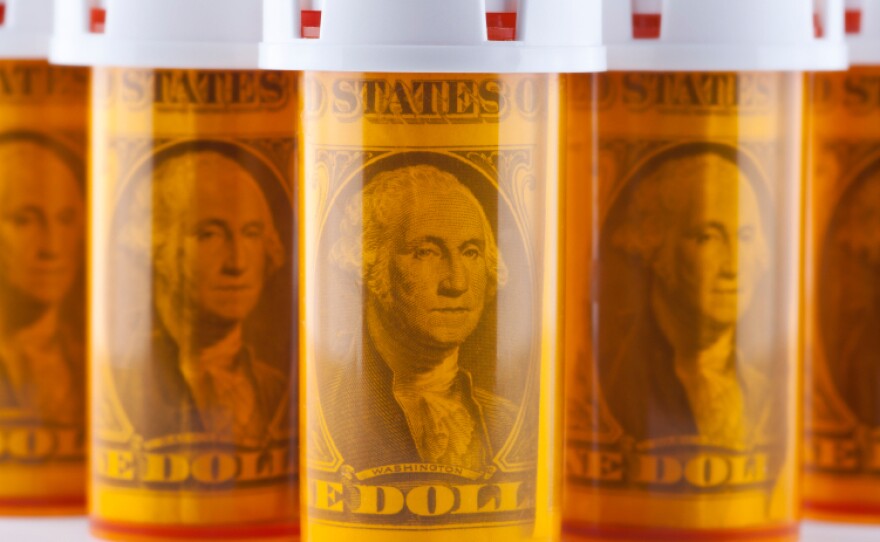Increased use of generic drugs caused a slight drop in the price of prescription drugs in 2012.