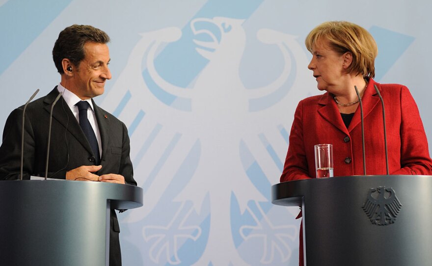 French President Nicolas Sarkozy (left) and German Chancellor Angela Merkel address a press conference in Berlin on June 14. France and Germany are at loggerheads over how to run European economic policy.