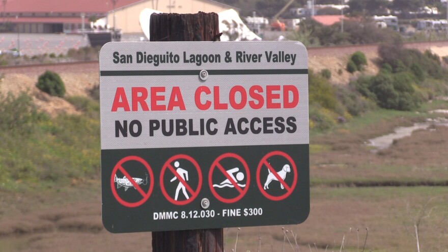 A sign restricting access to the San Dieguito Lagoon and River Valley next to the Del Mar Fairgrounds, April 13, 2021.
