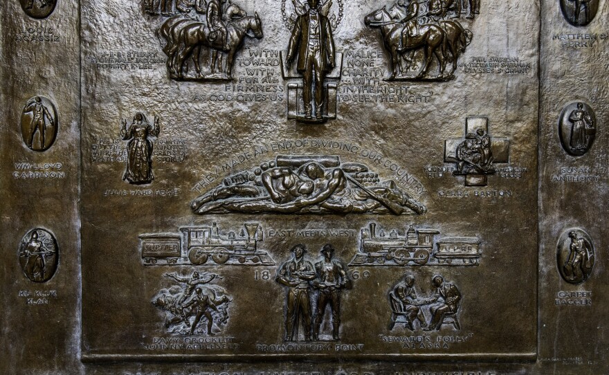 A closer view of the panel that includes an image of a Ku Klux Klan member.