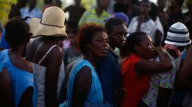 Women wait in a food distribution line in Port-au-Prince.
