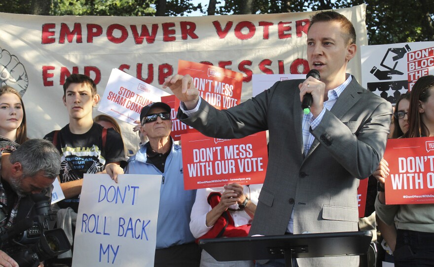 Jason Kander addresses a rally last year. He withdrew from the race for mayor of Kansas City, Mo., on Tuesday, saying he suffered from PTSD related to his military service in Afghanistan.