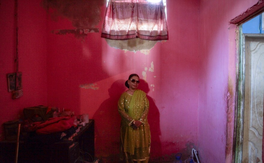 Mumtaz Begum, 60, stands in her clinic in Karachi, Pakistan. Begum says a midwife taught her how to induce abortions using medications freely available in Pakistan. Citing her religious faith, she says she would only help women who she believed were already miscarrying.