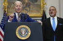 President Joe Biden speaks about student loan debt forgiveness at the White House on Wednesday, with U.S. Education Secretary Miguel Cardona by his side.
