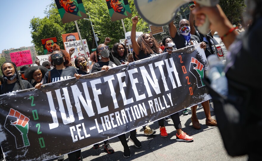 Protesters last year chanted as they marched after a Juneteenth rally at the Brooklyn Museum, in the Brooklyn borough of New York.