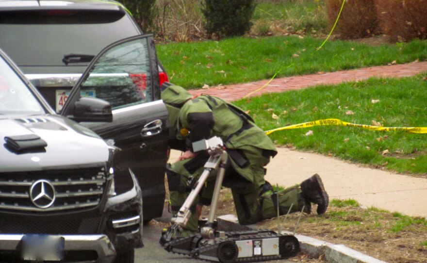 Law enforcement searches the hijacked Mercedes SUV.