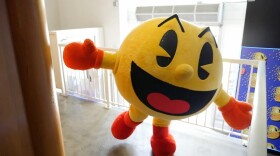 Pac-Man poses for a photo at the Pac-Man pop-up cafe in downtown San Diego in this undated photo. 