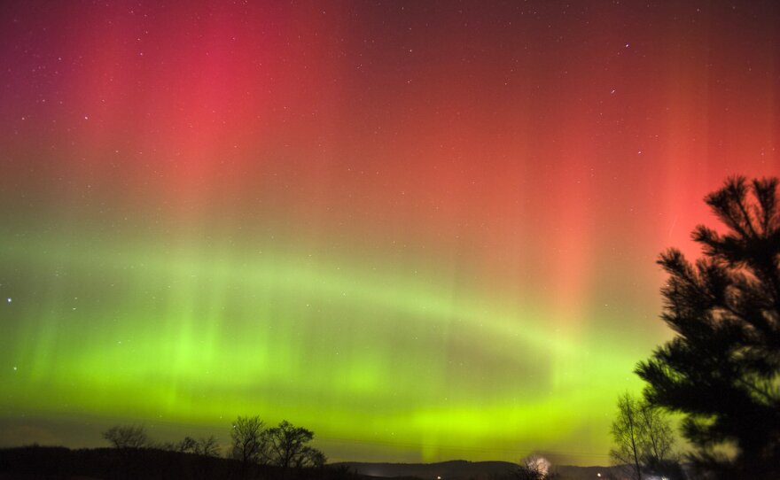 A view of the Northern Lights as seen from Crooktree in Aberdeenshire, Scotland, Thursday. The light show occurs when highly charged electrons from solar wind interact with Earth's atmosphere.