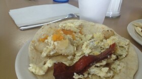 A bacon, egg, potato, and cheese taco.