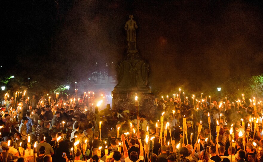 Neo-Nazis, white supremacists and other demonstrators encircle counterprotesters at the base of a statue of Thomas Jefferson on the University of Virginia campus in Charlottesville, Va., on Friday.
