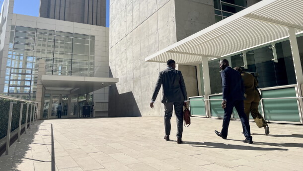 Attorney Wismick Saint-Jean walks into the United States Courthouse in downtown San Diego alongside his paralegal and Haitian Bridge Alliance co-founder Wister Gaetan, Oct, 16. 2026.
