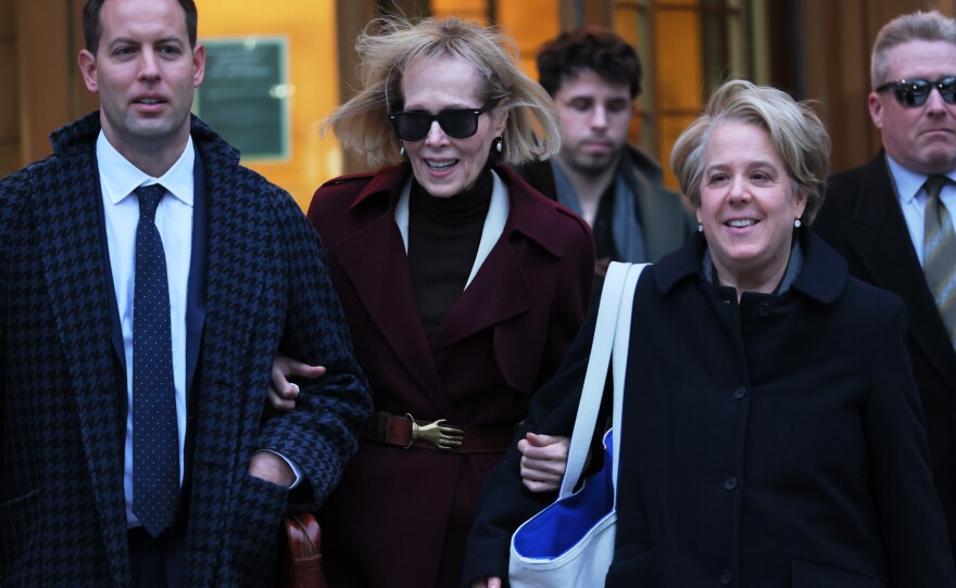 E. Jean Carroll (center) and her attorney Roberta Kaplan leave Manhattan Federal Court on Thursday in New York City.