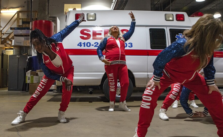 Wizdom dancers rehearse backstage before a performance at the Capitol One Arena.