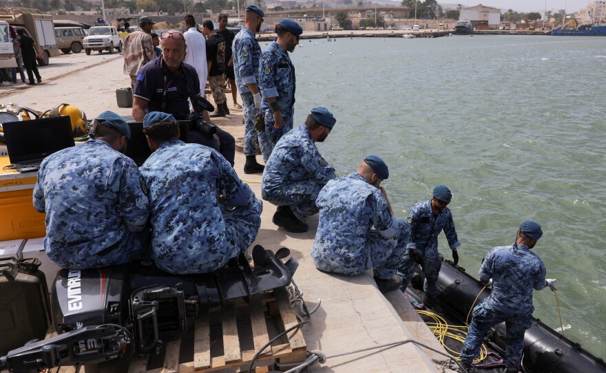 An Italian search and rescue team drops a boat during a search mission in Derna following fatal floods, Sept. 17.