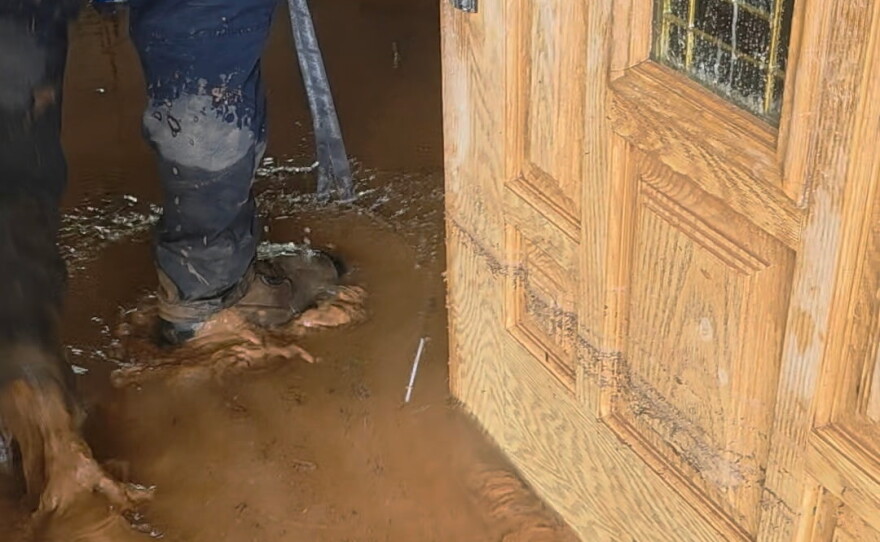 The view inside Juana Puga's flooded house in Hurricane, Utah, when she opened the door on Thursday.