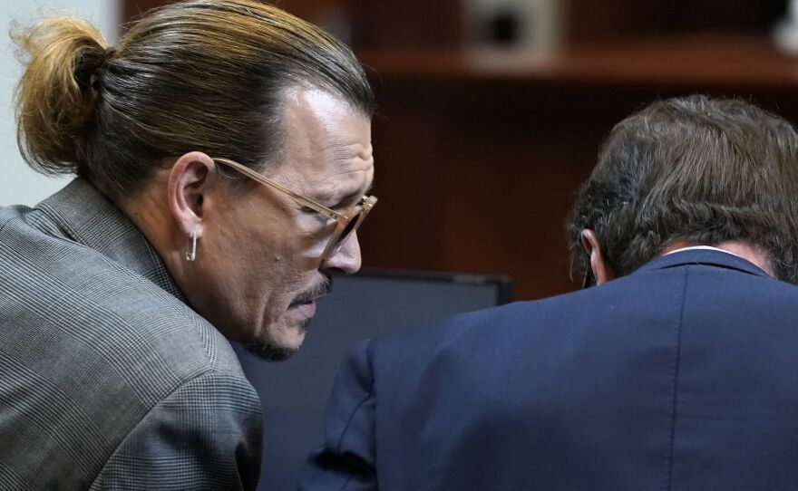 Actor Johnny Depp and his attorney Ben Chew at Fairfax County Circuit Court on Wednesday.