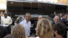 <p>With his bus in the background, President Barack Obama greets people outside of Mast General Store in Boone, N.C., Monday. Obama is on a three-day bus tour promoting the American Jobs Act. </p>