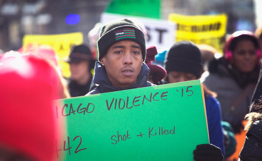 Demonstrators calling for an end to gun violence and the resignation of Mayor Rahm Emanuel march through downtown Chicago on December 31. More than 500 Chicagoans have been killed so far in 2016.