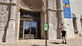 A woman walks towards the front exterior doors of San Diego Museum of Art, Sept. 2, 2026.