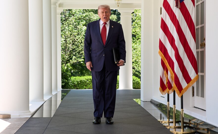 President Donald Trump walks through the Colonnade of the White House as he arrives to attend a luncheon for mothers Friday, May 8, 2026, in the Rose Garden of the White House, in Washington.