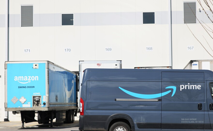 An Amazon delivery truck drives past Amazon's JFK8 Staten Island fulfillment center on March 25, 2022. Workers voted to unionize the warehouse, creating the first union at Amazon in the U.S.