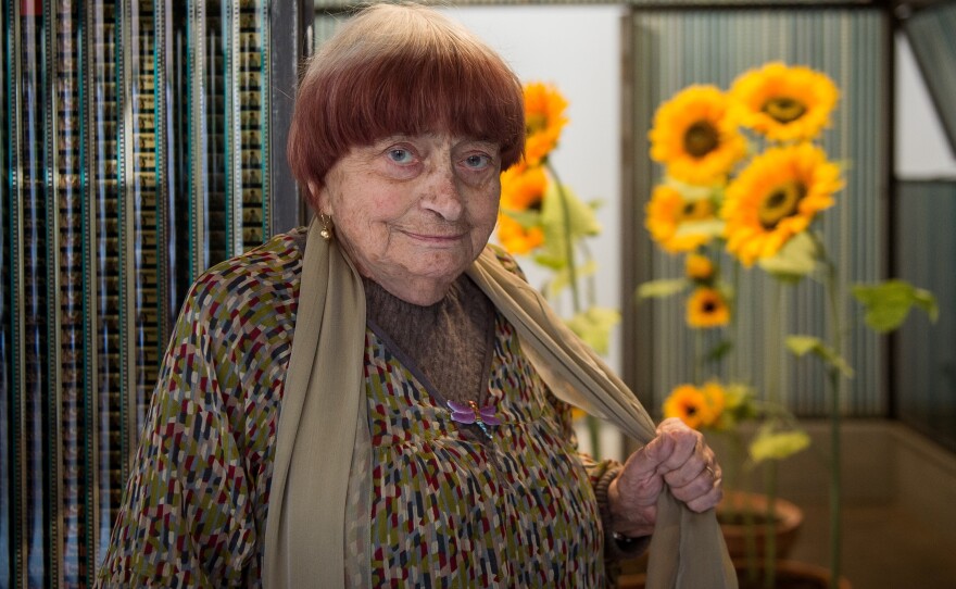 French director and artist Agnès Varda has died. She's seen here posing next to her installation "La serre du bonheur" at the Chaumont-sur-Loire castle on March 23.