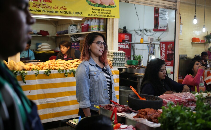 Anais Martinez, a guide with Eat Mexico, leads tours of the sprawling Merced market in Mexico City, where stalls sell tacos, sandwiches and pastries. A huge meal can cost less than $2.