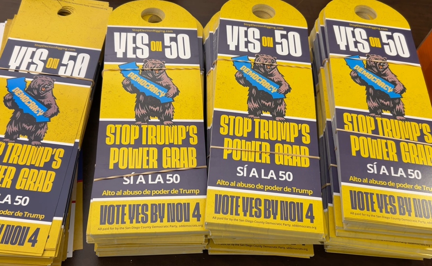 Door hangers in support of Prop 50. They read "Stop Trump's Power Grap" and "Alto al abuso de poder de Trump"