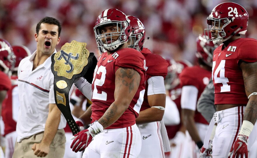 Linebacker Ryan Anderson of Alabama holds a faux championship belt Monday night during the first half in Tampa.