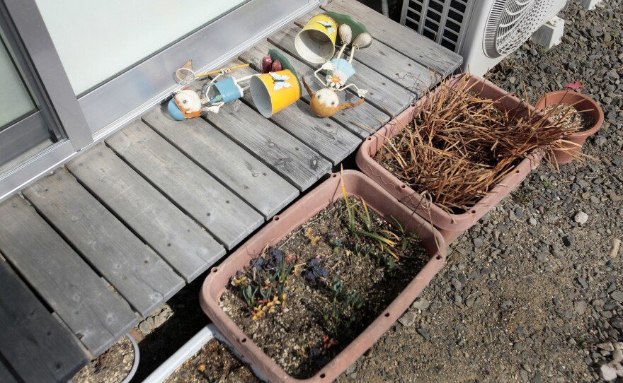 Toys sit on the veranda of one of the temporary homes.
