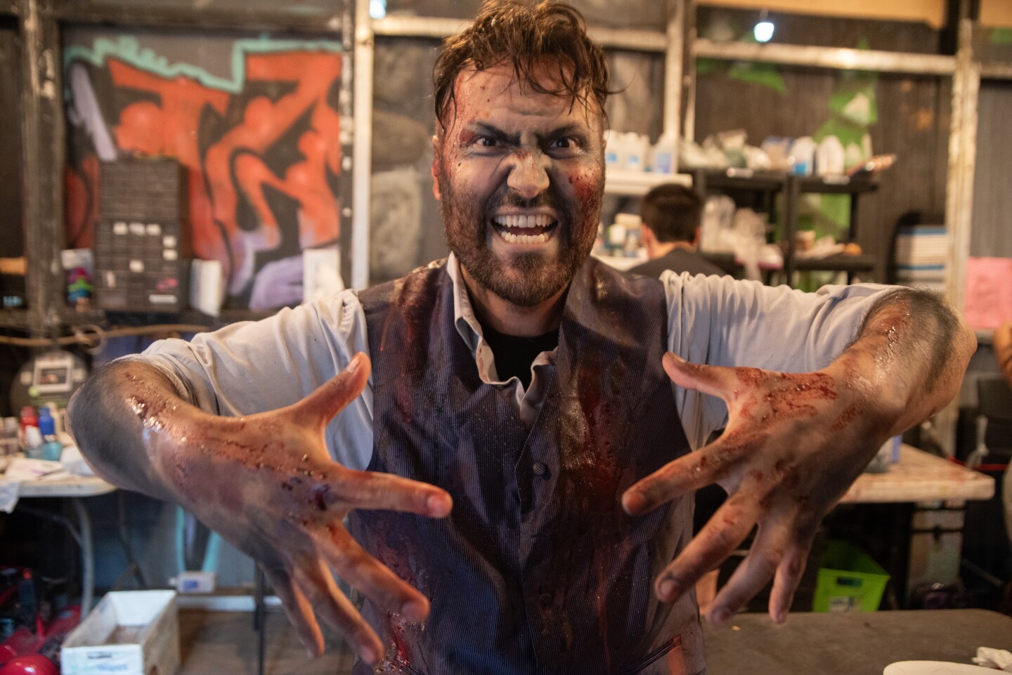 Scare actor Sergio Whitaker is ready to attack some willing victims at The Haunted Trail in Balboa Park on Sept. 25, 2025.
