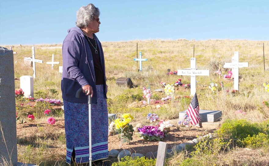 Betty Friday looks over her family's graves at Friday Cemetery, Ethete, Wind River Reservation