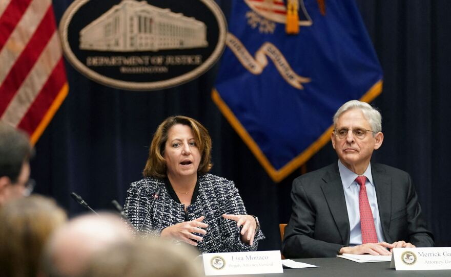 Deputy Attorney General Lisa Monaco, seen here with Attorney General Merrick Garland in March, said in an interview this year at her alma mater, the University of Chicago: "We look at and investigate the crimes in front of us, and then we work our way up. ... It's very important to do that in a methodical way so that people don't think you are starting from an assumption."
