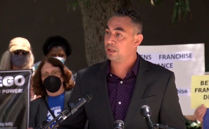 San Diego City Councilmember Sean Elo-Rivera speaks at a rally on San Diego's electric and gas franchises, April 19, 2021.<br/>