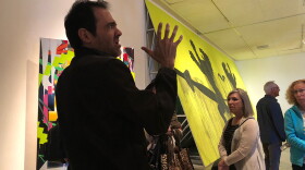 In this photo taken October 2018, Tijuana artist Daniel Ruanova shows a tour group with the Museum of Contemporary Art San Diego his exhibition at Centro Cultural Tijuana. 