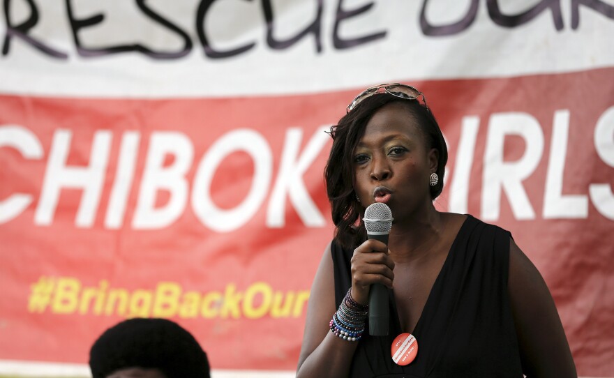 Maureen B. Kabrik, a "#Bring Back Our Girls" campaigner, speaks during a sit-out meeting in Borno in support of the release of more than 200 Nigerian schoolgirls in August. Boko Haram militants, who seized the girls last April, have reportedly captured a key military base in the region.