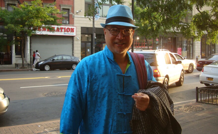 Fred Ho is known for the bright clothing he wears, which he makes himself.