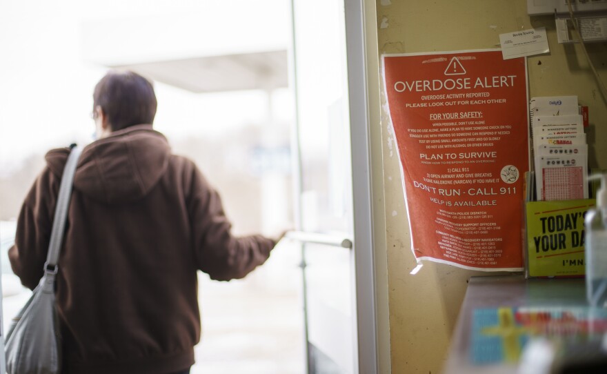 A sign calling attention to drug overdoses is posted in a gas station on the White Earth reservation in Ogema, Minn.. A new study shows that early deaths due to addiction and suicide have impacted American Indian and Alaska Native communities far more than white communities.