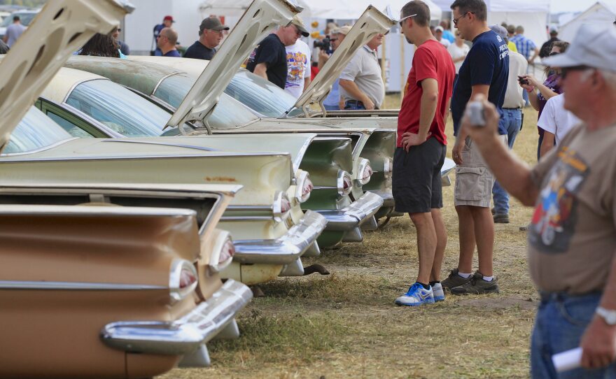 The trunks of Chevrolet sedans are open for Friday's preview before an auction of vintage cars and trucks from the former Lambrecht Chevrolet dealership.