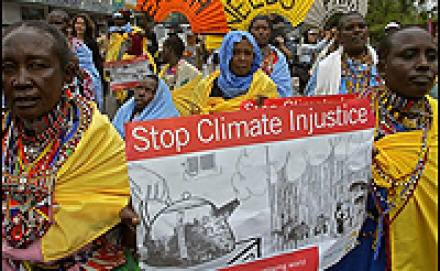 Maasai protesters in Kenya hold placards during a march appealing for "urgent action" to fight climate change. The Maasai say global warming for which they are not responsible is destroying their traditional way of life.