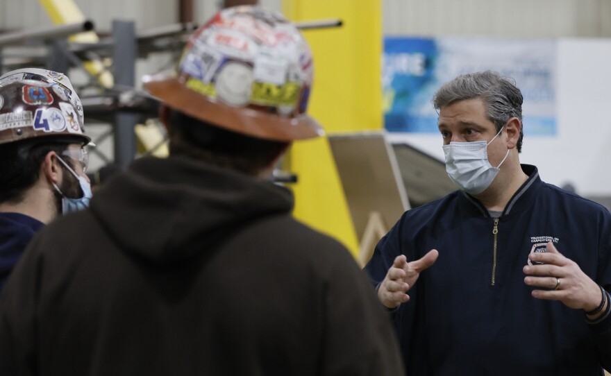 Rep. Tim Ryan, right, a Democrat running for an open U.S. Senate seat in Ohio, talks with apprentices while touring the South Central Ohio Carpenters' Training Center outside Columbus on Jan. 25. Ryan is trying to flip a Republican-held seat.