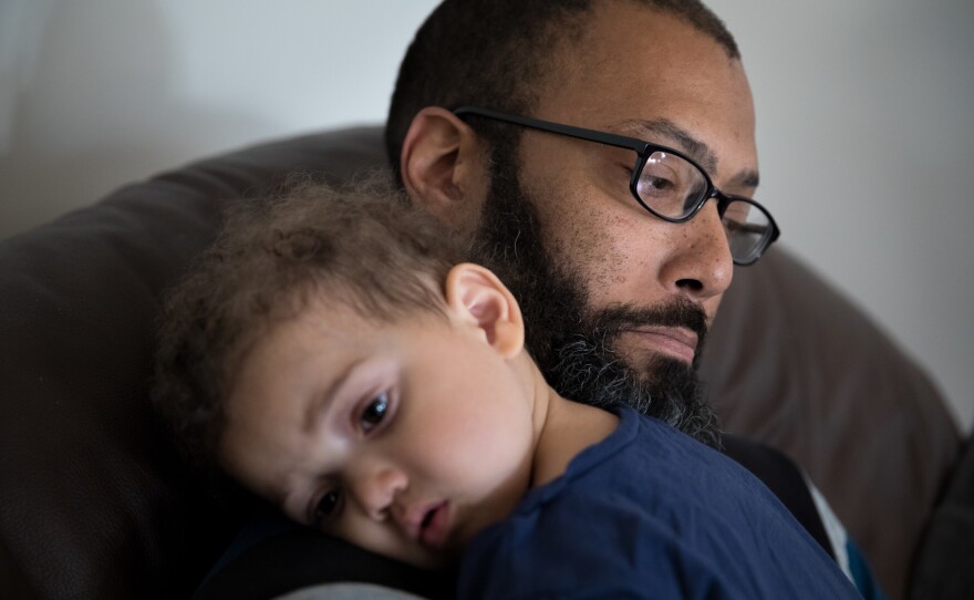 Donerson cuddles daughter Tricia, 1.