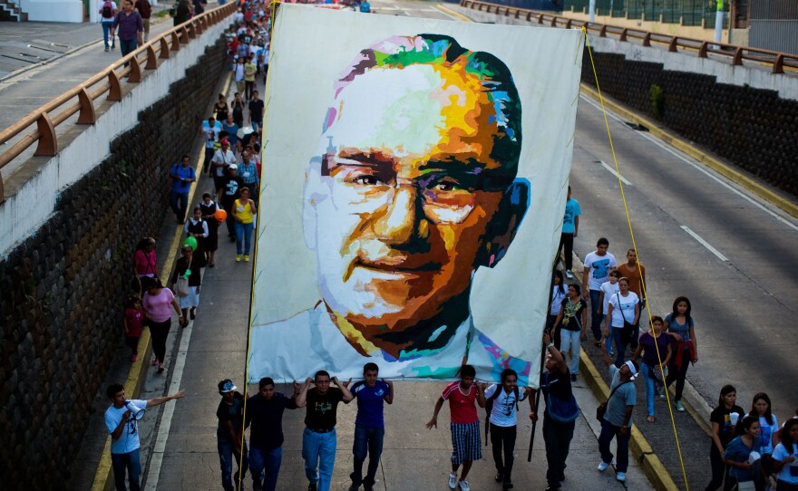 Catholics march in San Salvador on March 22, 2014, during the commemoration of the 33th anniversary of Romero's murder.