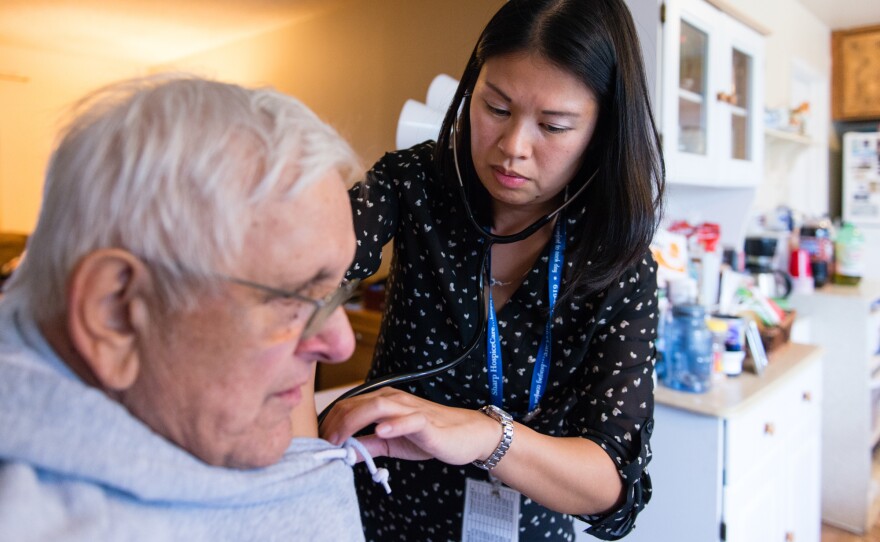 Chinchar (left) is now 77. He told nurse Sheri Juan he never expected to live into old age. In his family, he said, "you're an old-timer if you make 60."