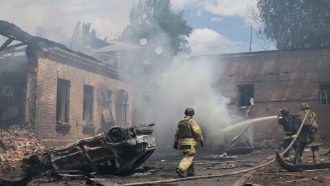 Rescue workers put out a fire at a building destroyed after a Russian strike on Zaporizhzhia, Ukraine, on Friday.