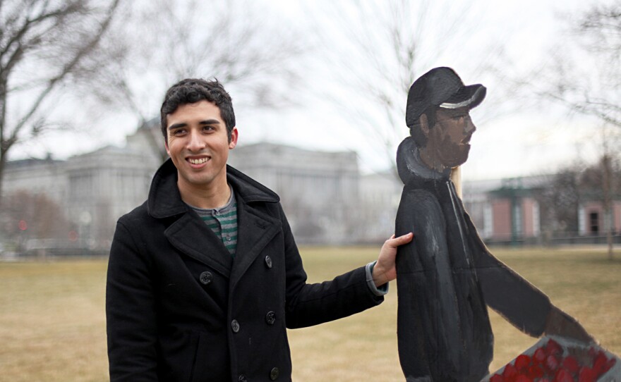 Los Angeles-based artist Ramiro Gomez Jr. displays his immigrant worker art on the Capitol's East Lawn in Washington, D.C.