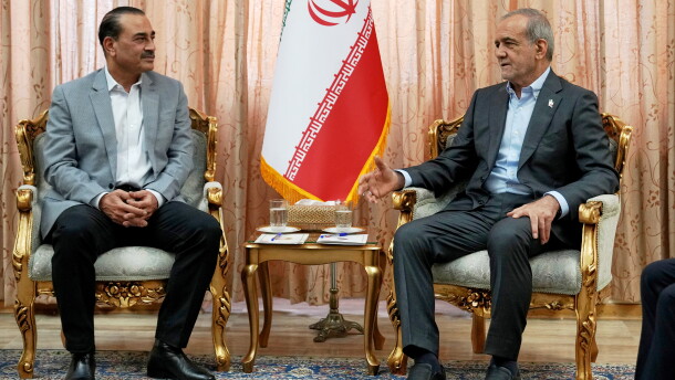 In this photo released by the Iranian Presidency Office, President Masoud Pezeshkian, right, speaks with Pakistan's Army Chief Field Marshal Gen. Asim Munir in Tehran, Iran, Saturday, May 23, 2026.