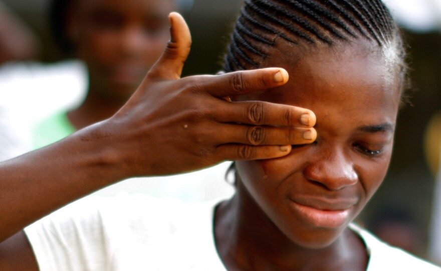 "Thank you for taking care of my children," Weah Korveh says as she reunites with her 3-month old son, Sekou Dukely, in Jacobstown. Korveh recovered from Ebola but lost several family members to the disease.