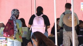 San Diego City College students speak with Basic Needs Center staff at a CalFresh application event on Tuesday, Oct. 28, 2025.